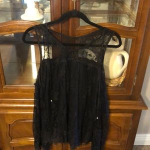Black lace blouse, very cute, sleeves are long and, ties around the front